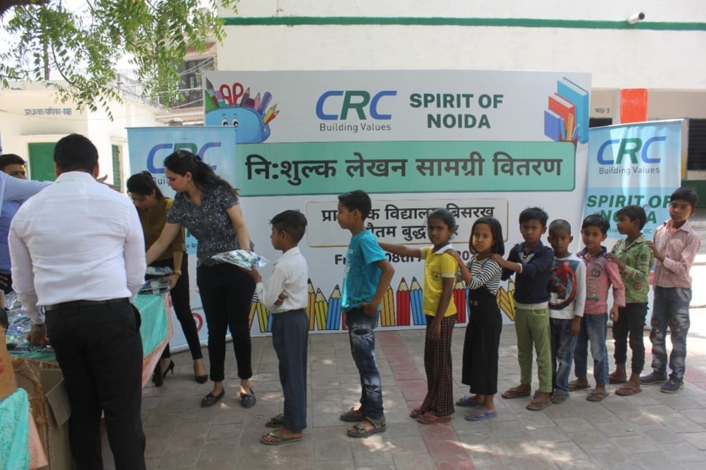 Stationary distribution to school children under CRC Group's Spirit of Noida campaign 1 CRC Book distribution