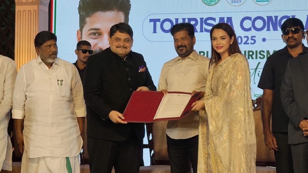 Telangana Chief Minister A. Revanth Reddy awards VP Marketing and Corporate Communication of Ridhira Group Preeti Logan and a colleague