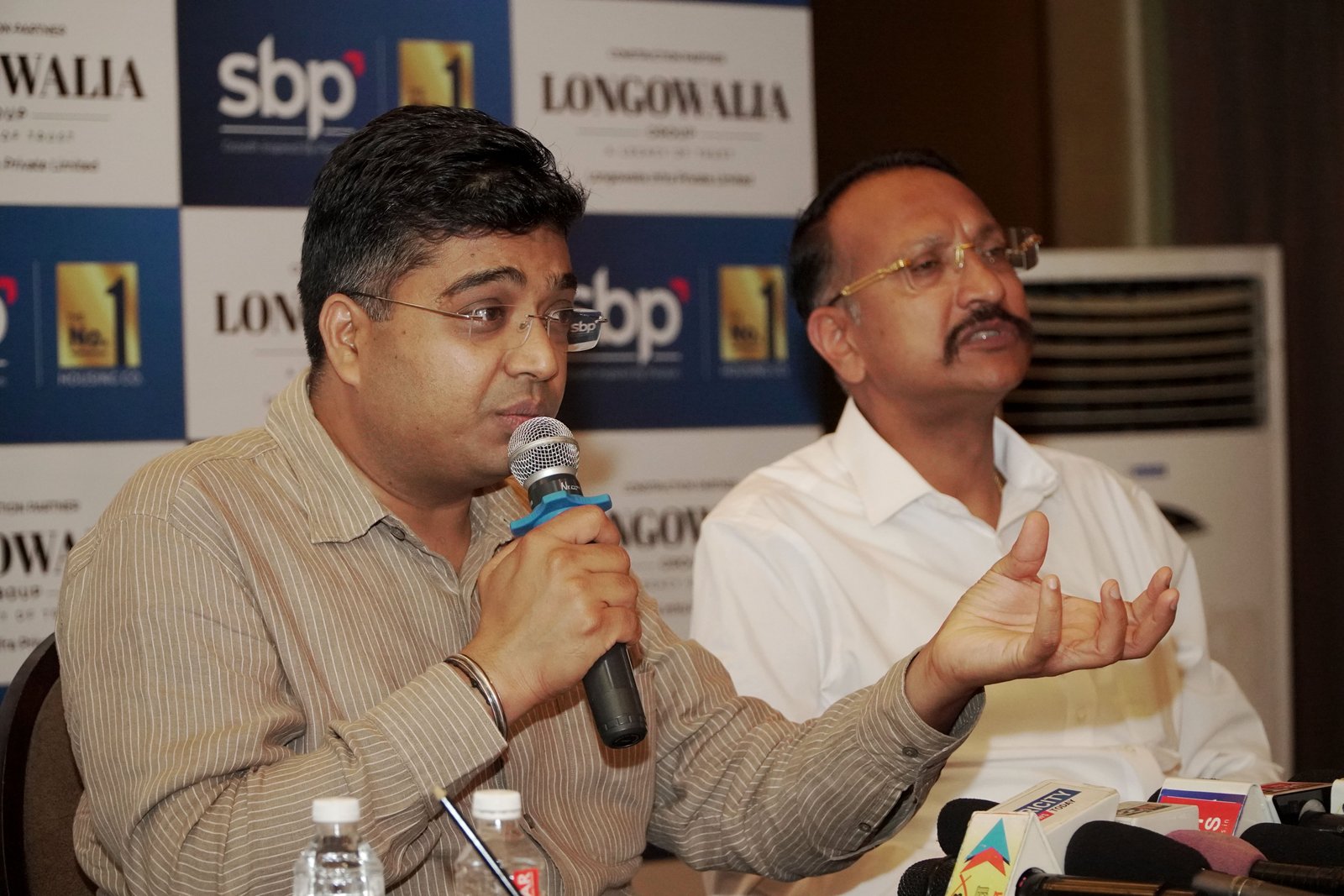 L R SBP Group Chairman and Managing Director Aman Singla and Sandeep Longowalia MD Longowalia Infra Private Limited addressing the media
